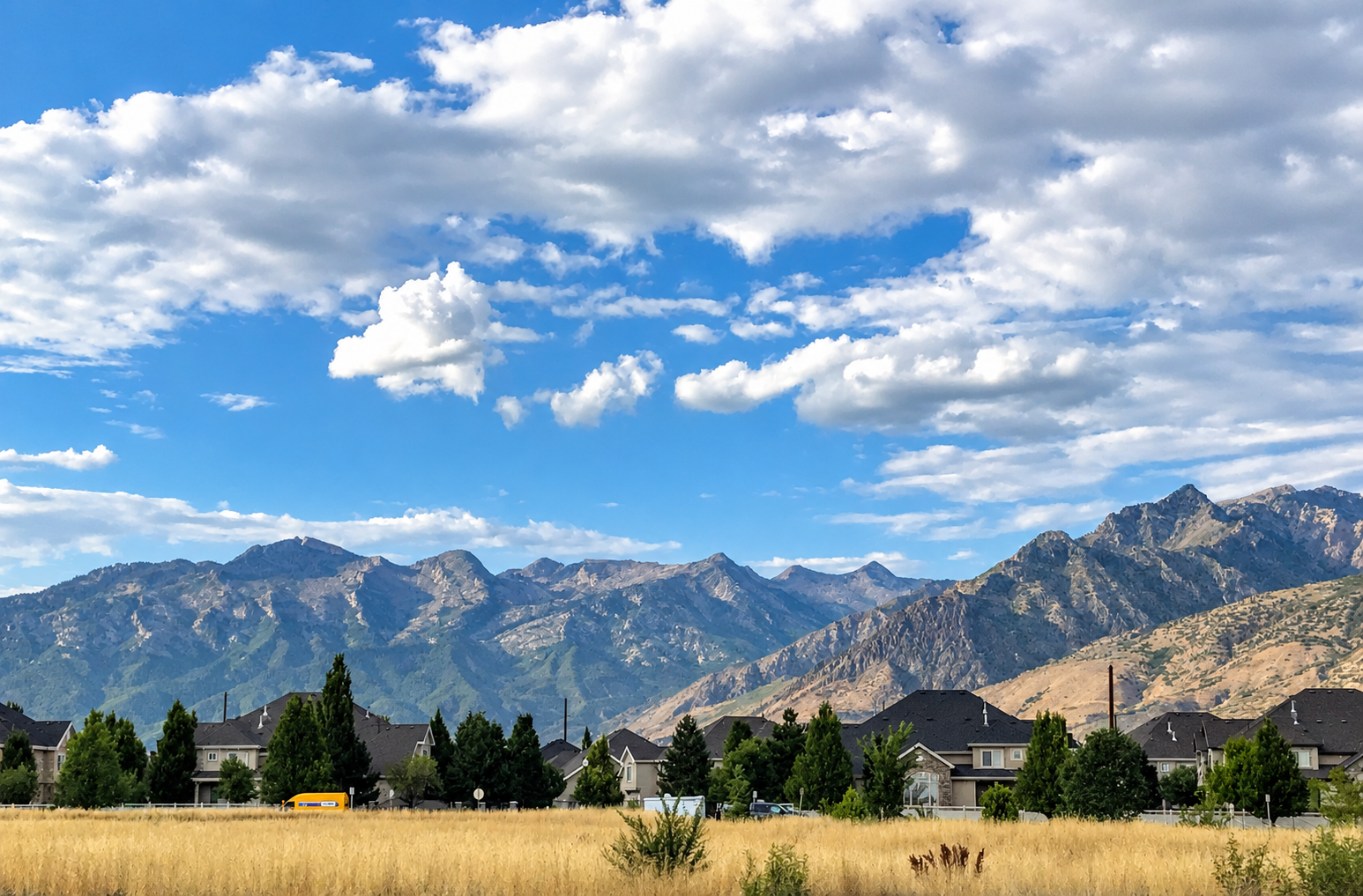 Utah HOA community with landscaped common areas and mountain views